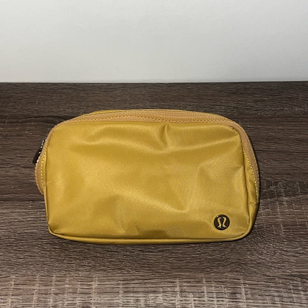 Lululemon brand new belt bag NWOT. Calm yellow color